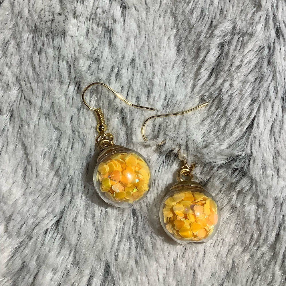 Snow globe yellow hearts hand crafted earrings